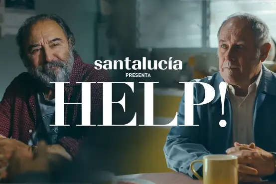 Imagen de la campaña HELP! No hay nada más humano que ayudar y ser ayudado de Santalucía, con dos personas conversando en una cocina
